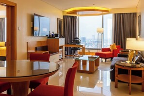 Deluxe Suite, 1 Bedroom | Living area | TV, DVD player