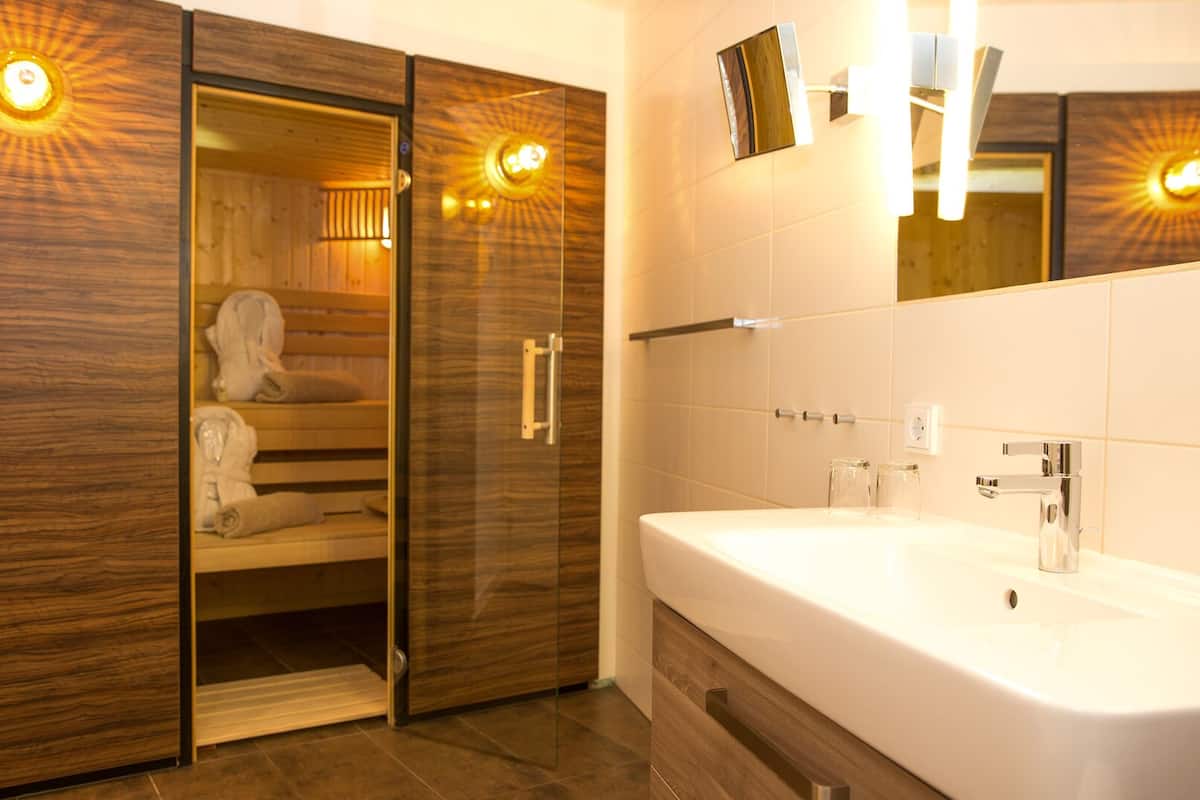 superior room with sauna | bathroom | free toiletries, hair dryer, towels, soap