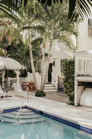 Outdoor pool, open 7:00 AM to 10:00 PM, pool loungers