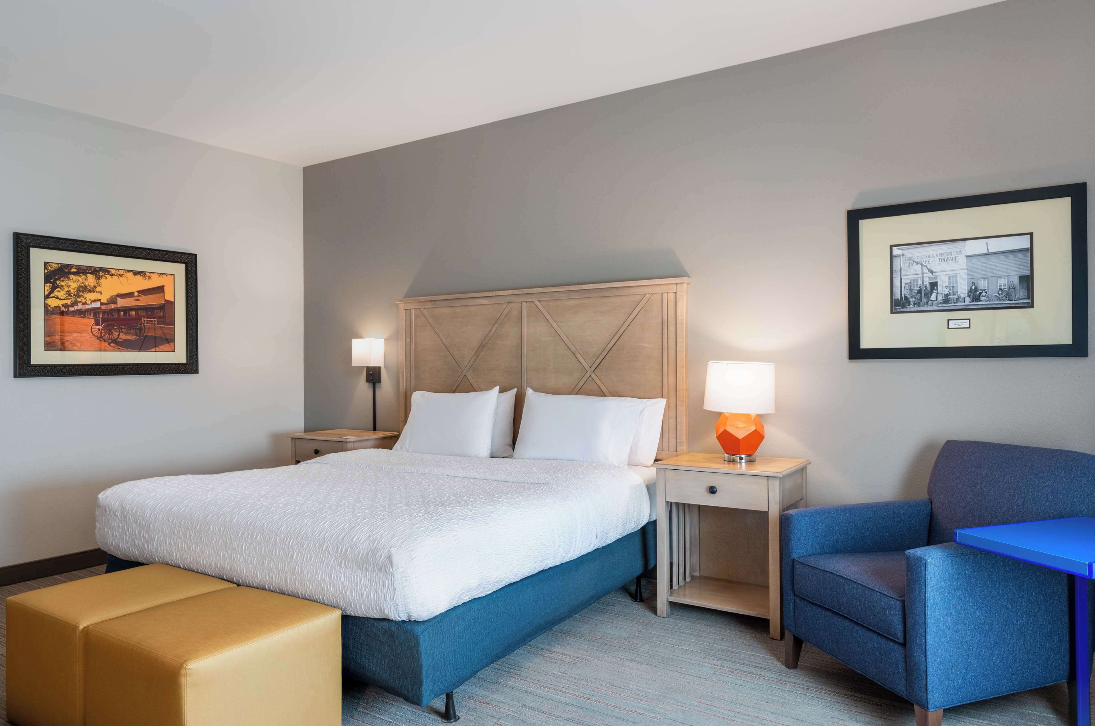 Premium bedding, desk, laptop workspace, blackout drapes