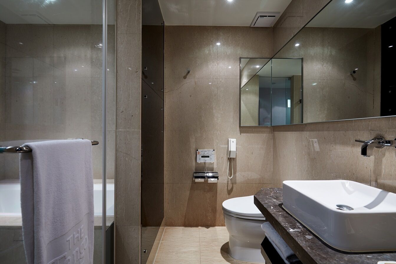 junior king room | bathroom | eco-friendly toiletries, hair dryer, bathrobes, slippers