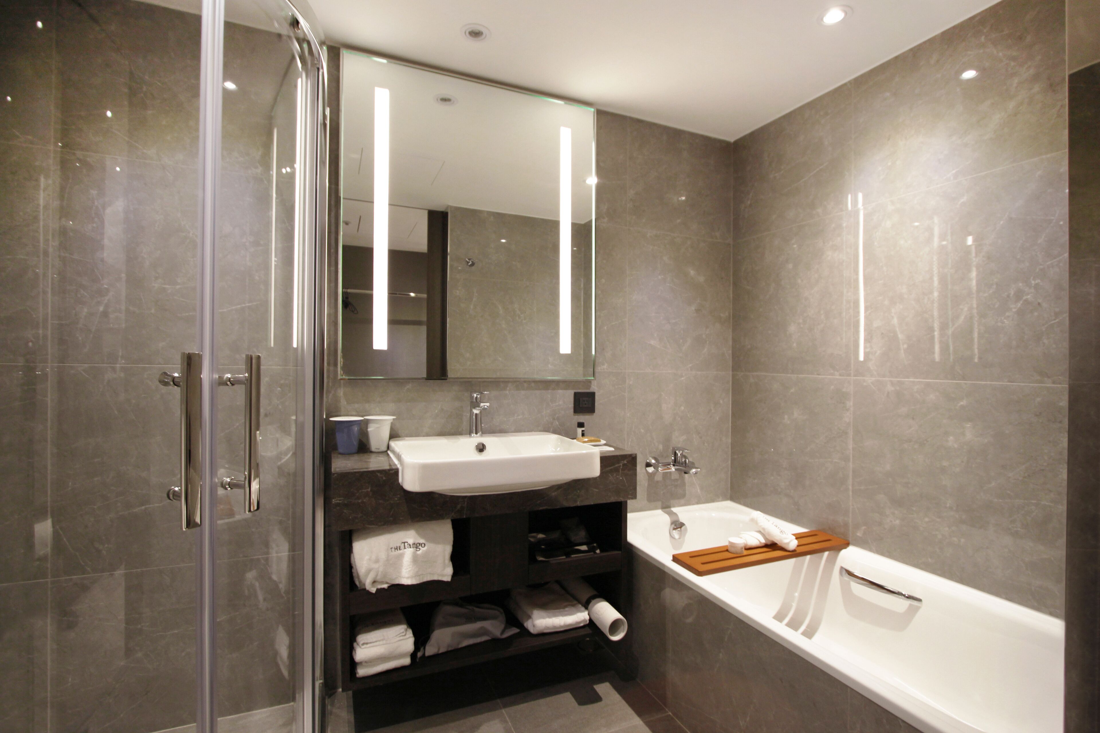 superior king room | bathroom | eco-friendly toiletries, hair dryer, bathrobes, slippers