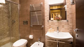 Shower, rainfall showerhead, bidet, towels