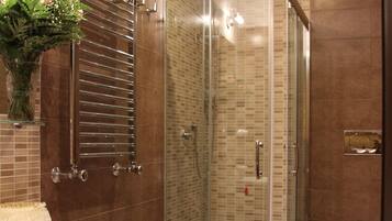 Shower, rainfall showerhead, bidet, towels
