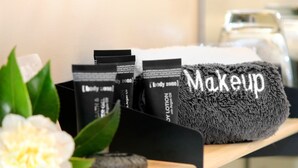 A shelf with makeup products and a towel labeled "Makeup". - Bella Vista Motel Invercargill (Invercargill)