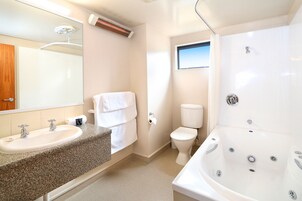 One Bedroom Unit | Bathroom | Hair dryer, towels, soap, shampoo