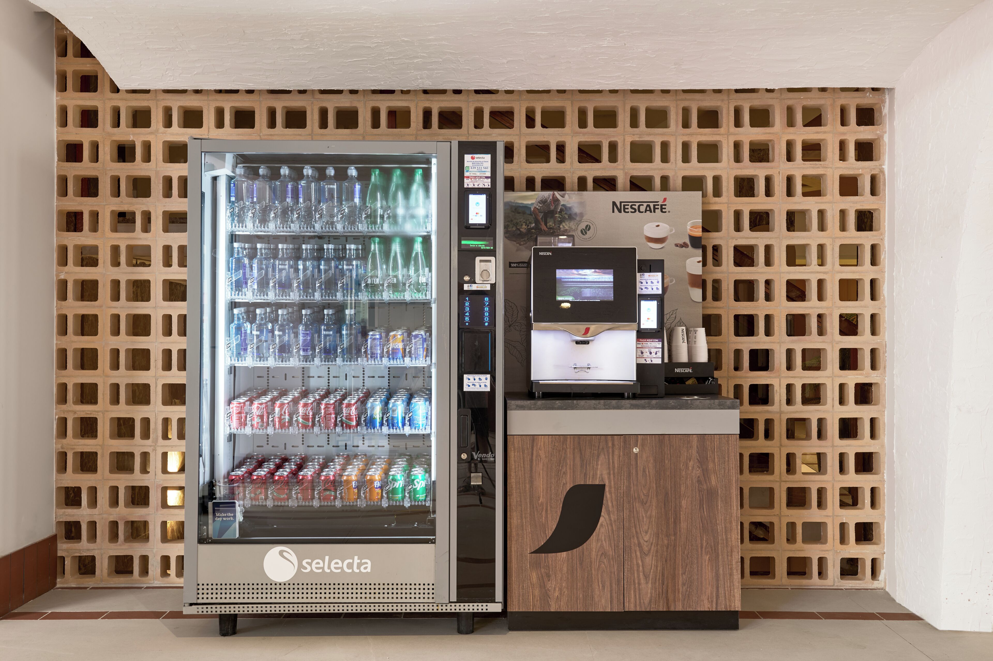 A vending machine with a touchscreen interface and a beverage dispenser.