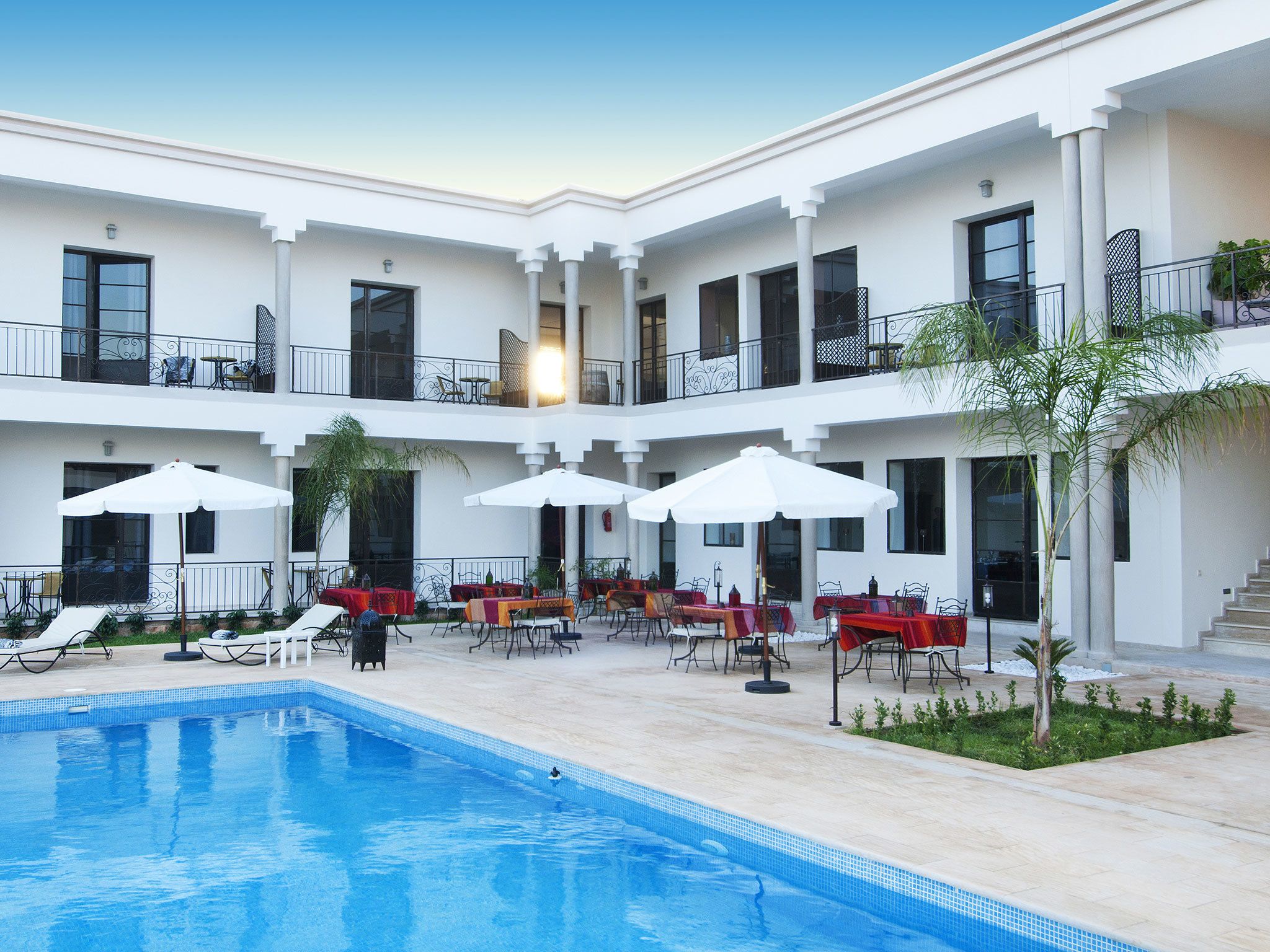 outdoor pool, pool umbrellas, pool loungers