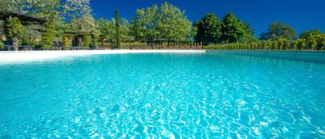 2 outdoor pools, open 9:00 AM to 6:00 PM, pool loungers