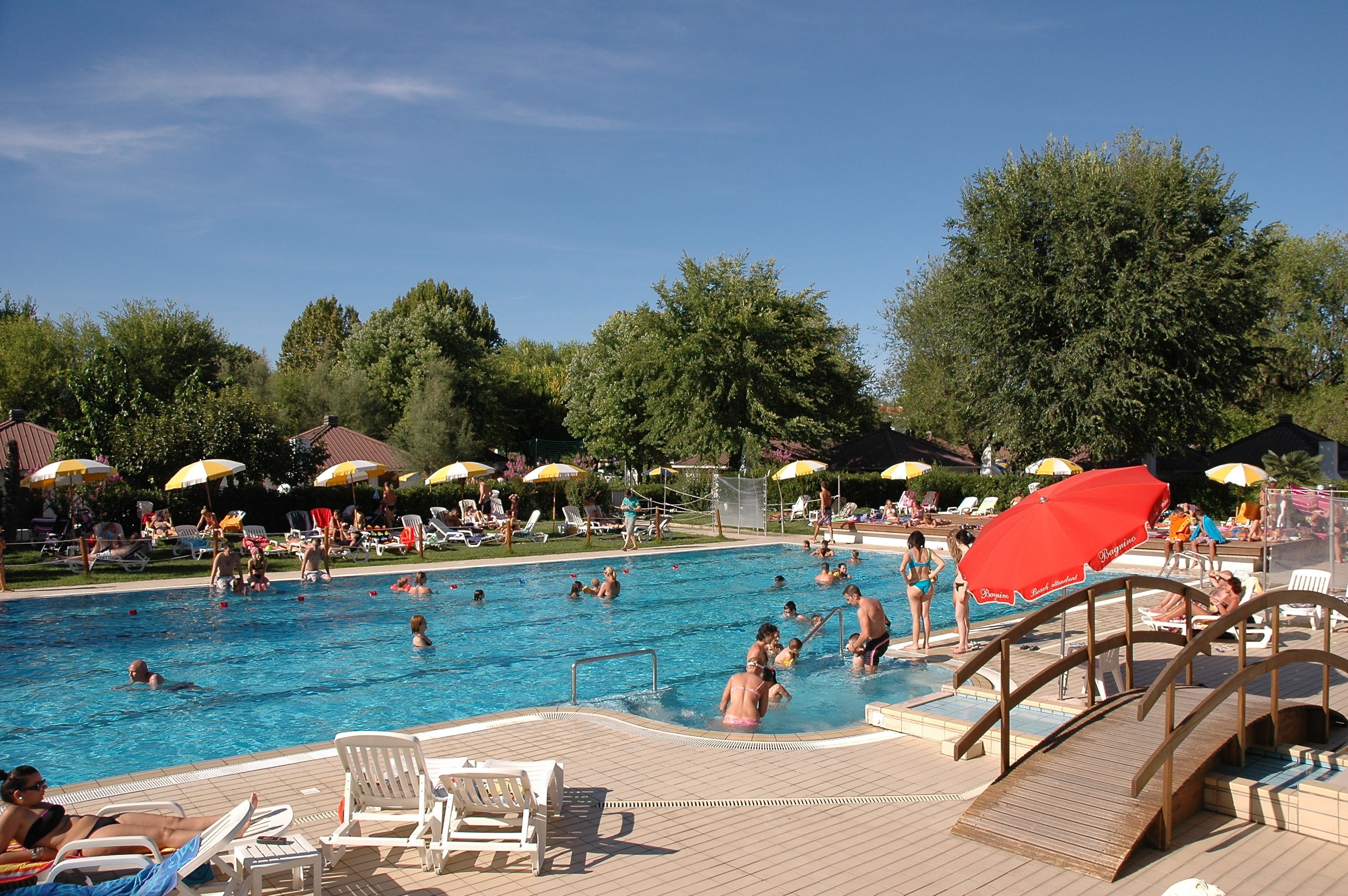 seasonal outdoor pool, pool umbrellas, pool loungers