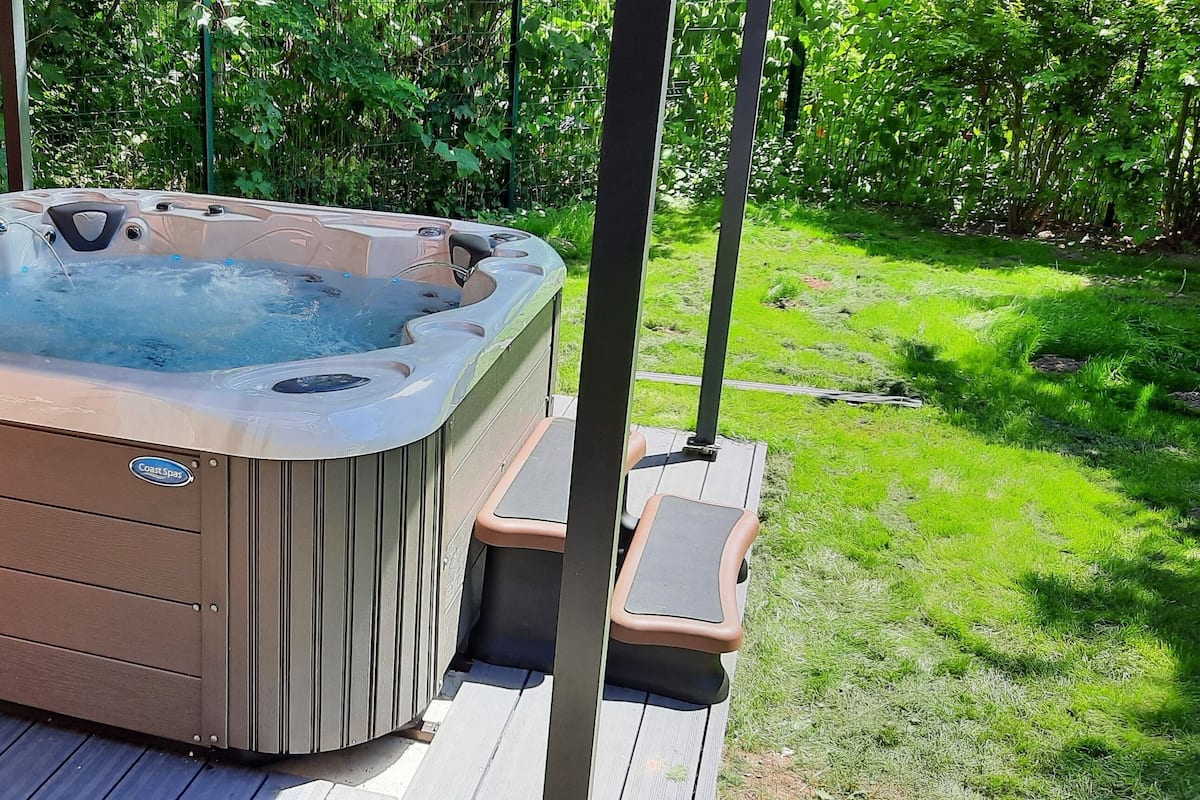 Deluxe appartement, 1 slaapkamer, hot tub, op benedenverdieping | 1 slaapkamer, verduisterende gordijnen, geluiddichte muren