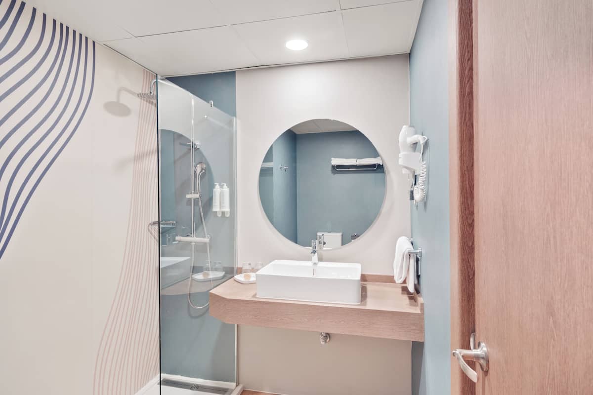 shower, eco-friendly toiletries, hair dryer, towels