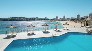 Seasonal outdoor pool, open 10:00 AM to 8:00 PM, pool umbrellas