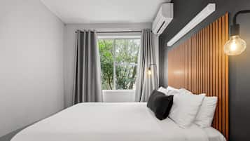 Habitación familiar | Ropa de cama de alta calidad y artículos del minibar gratis