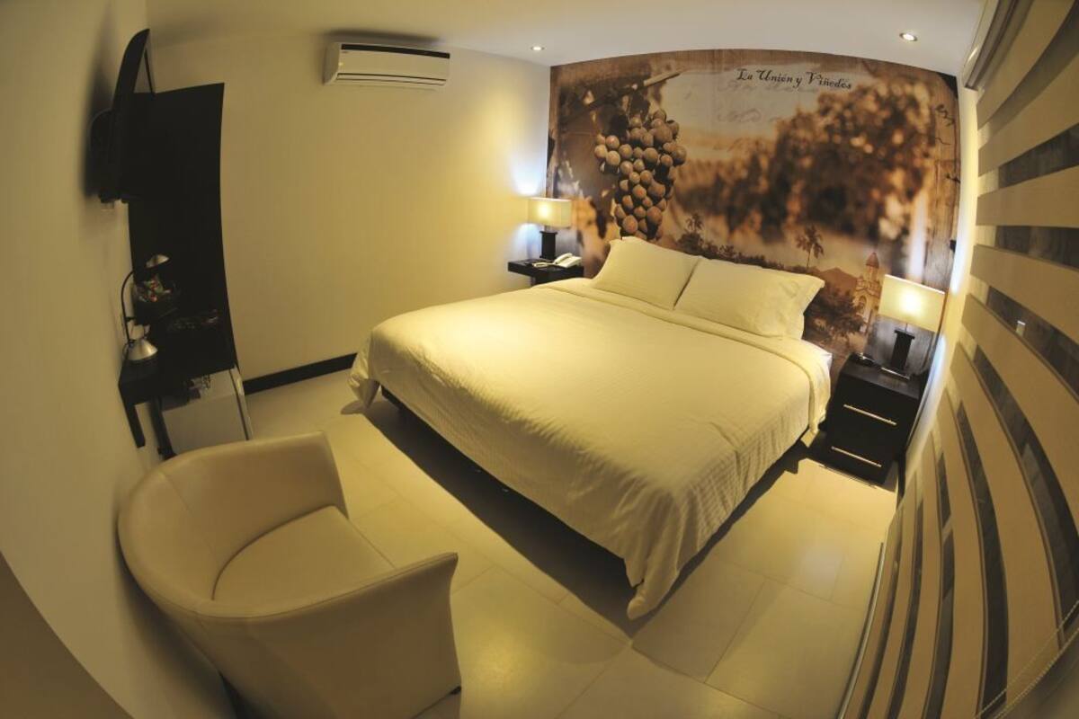 Habitación Deluxe | Ropa de cama de alta calidad y edredones de plumas
