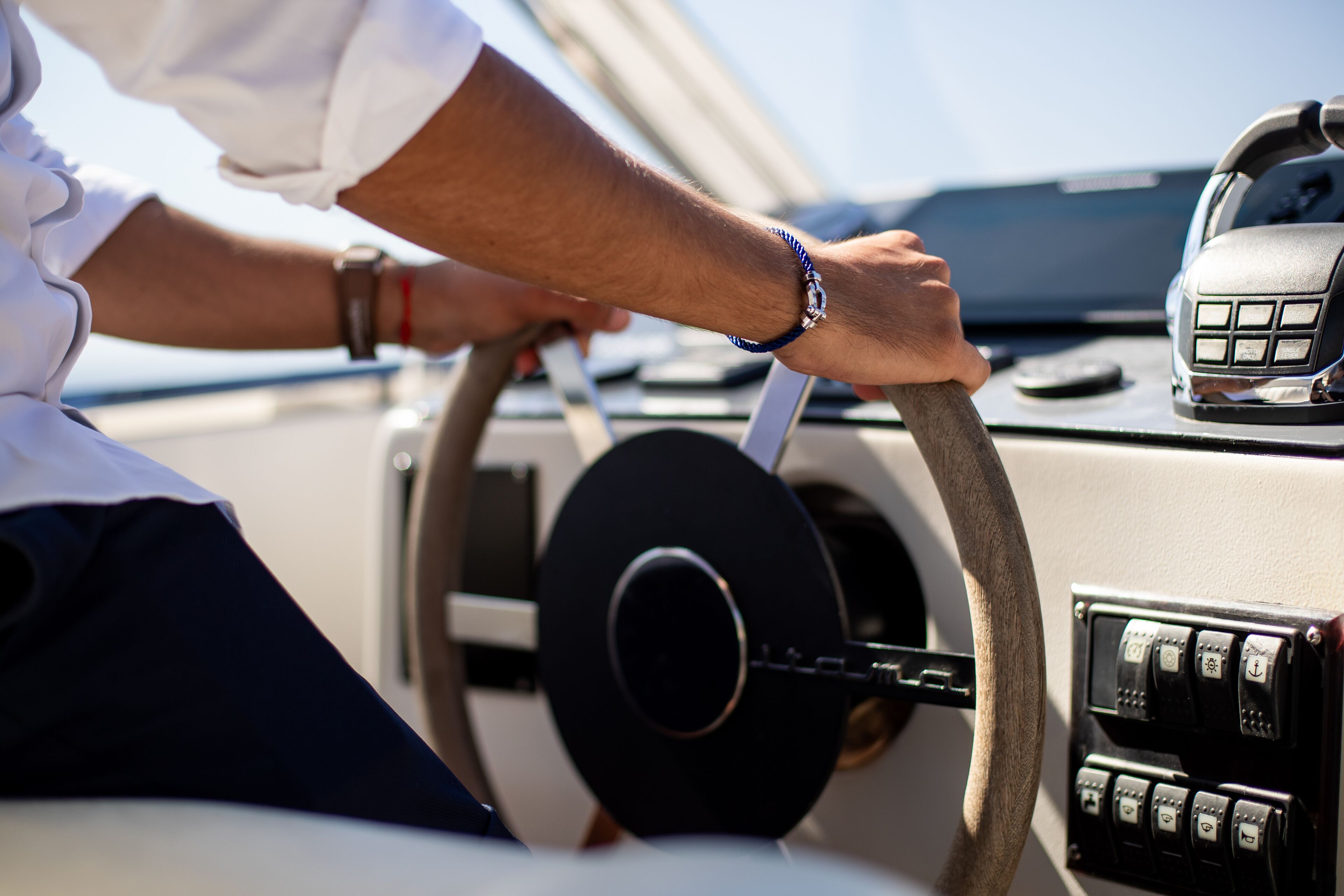 A steering wheel and dashboard of a vehicle.
