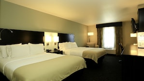 A hotel room with two beds, a desk, a chair, a TV, and a window with curtains. - Holiday Inn Express Hotel & Suites Marion Northeast by IHG (Marion)