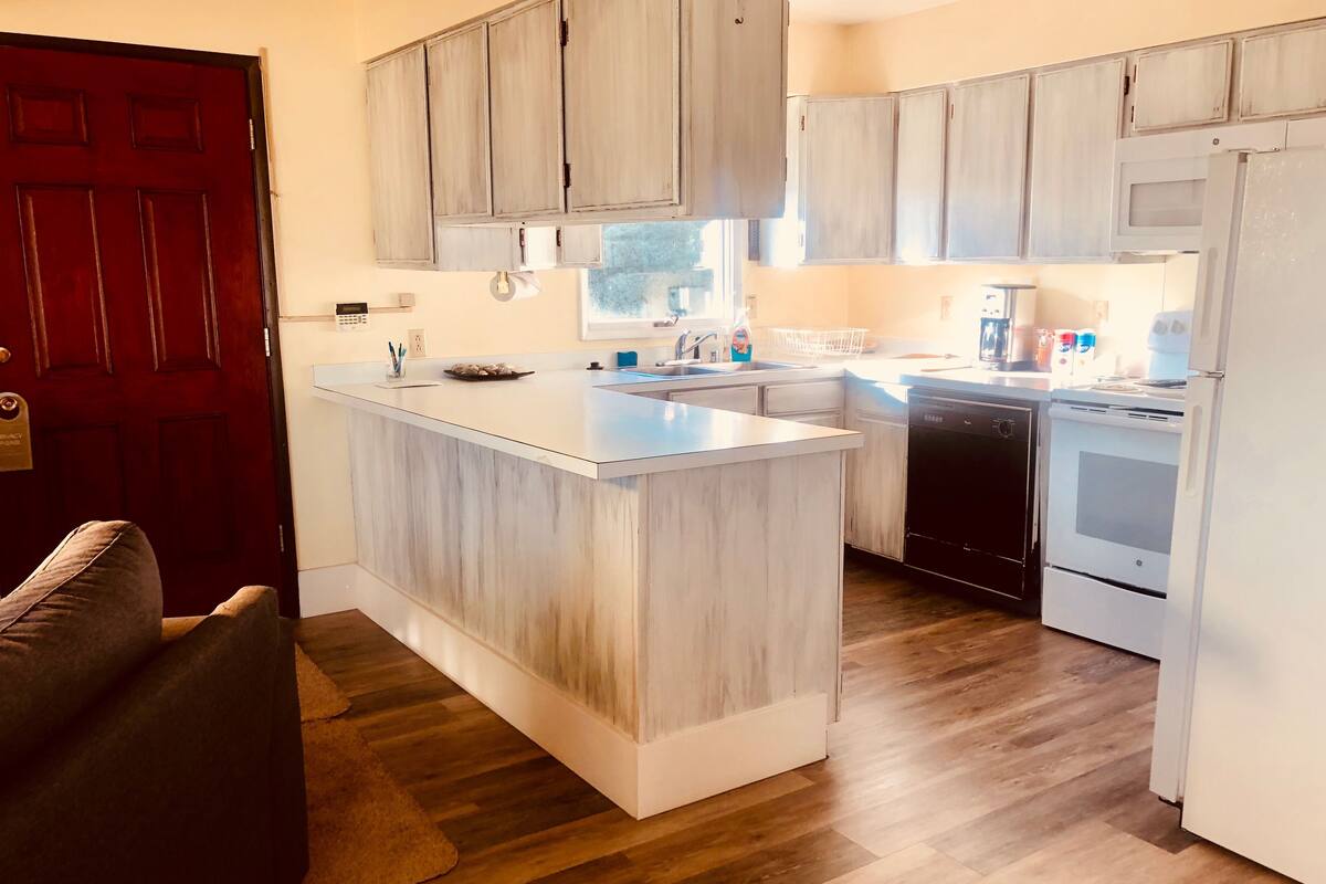 woodside suite #1, two bedrooms with kitchen, partial view, stairs | private kitchen