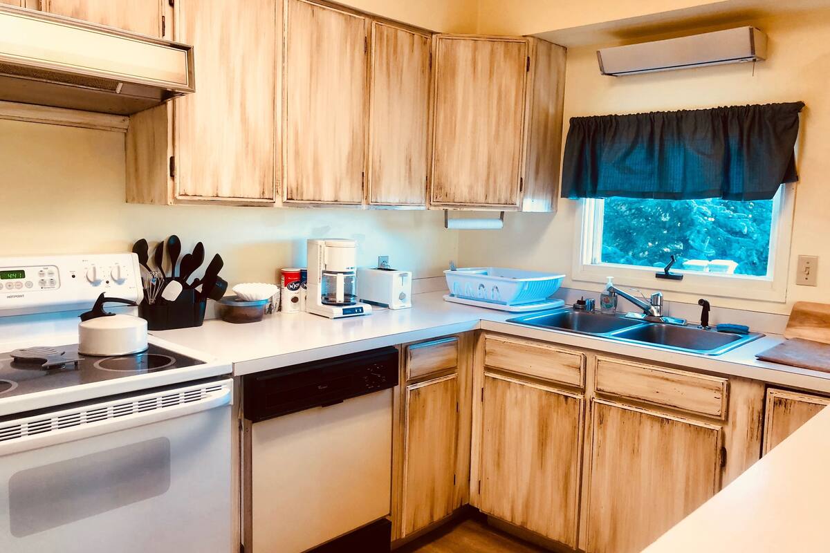 woodside suite #2, two bedrooms with kitchen, partial view, stairs | private kitchen