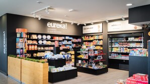 A modern retail store with shelves stocked with various products, a refrigerated section, and a display area with boxed items. - As Hotels Chucena (Chucena)