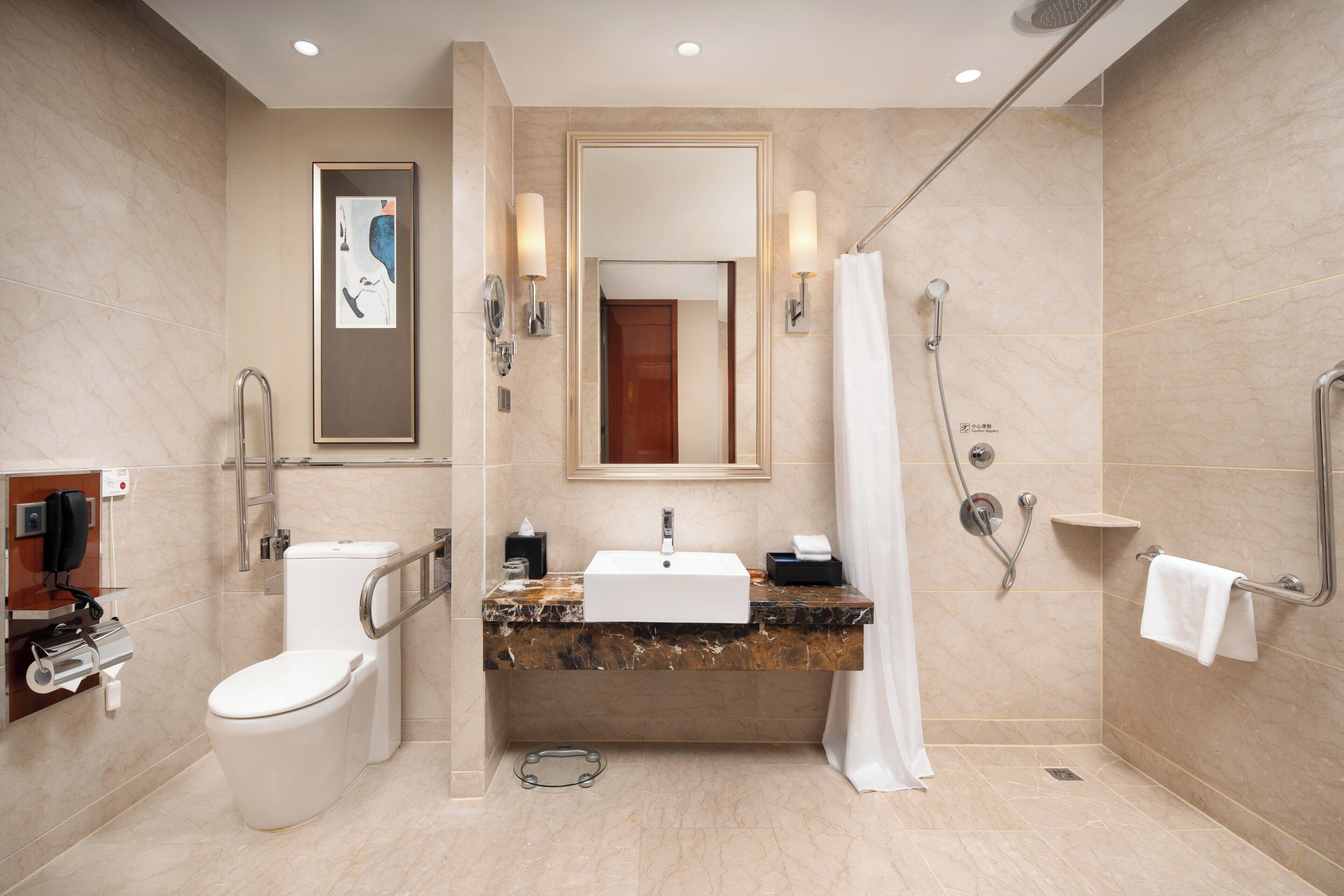 Un baño moderno con inodoro, lavabo y ducha.