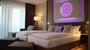 Hypo-allergenic bedding, down duvets, pillow-top beds, in-room safe