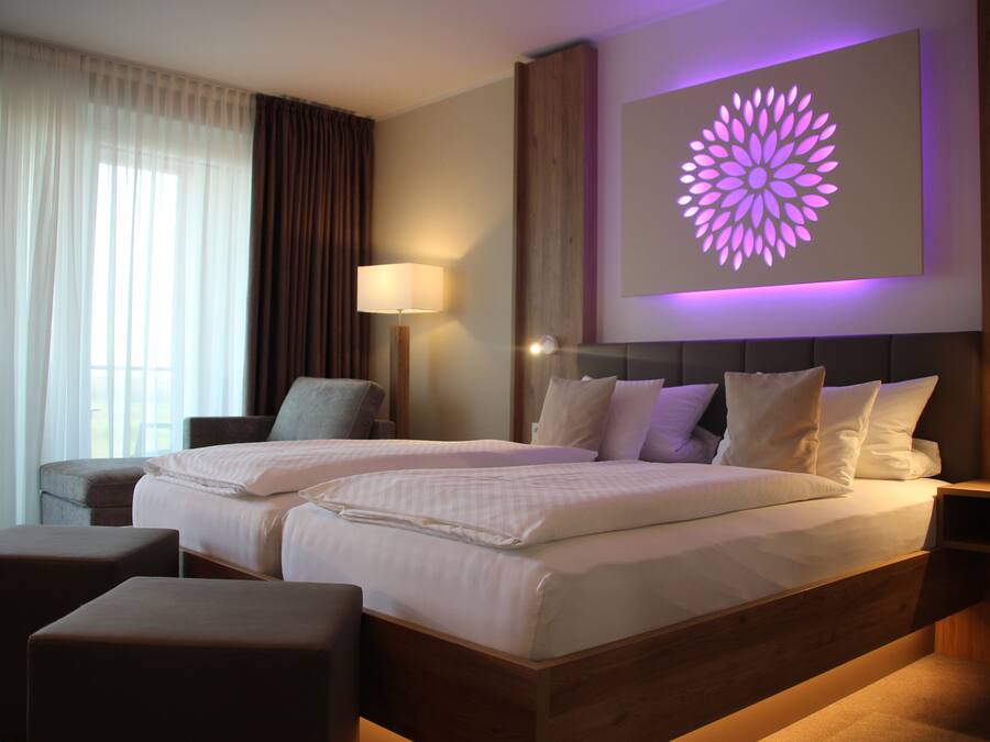 Hypo-allergenic bedding, down comforters, pillowtop beds, in-room safe