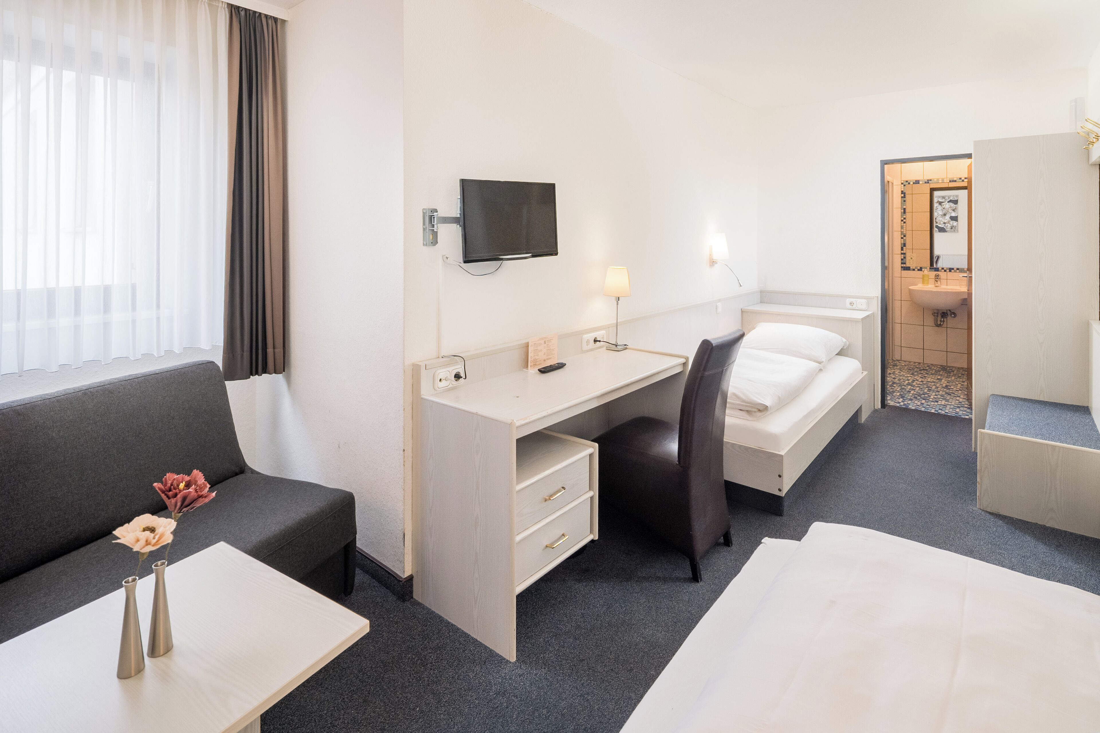 triple room | premium bedding, down duvets, desk, blackout curtains