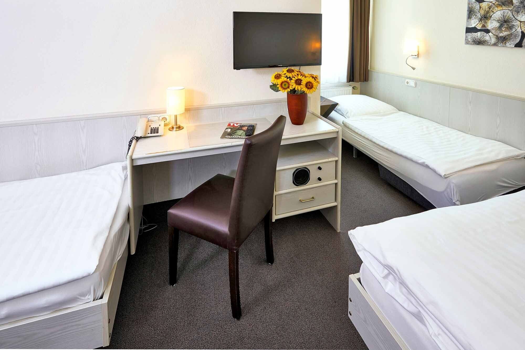 triple room | premium bedding, down duvets, desk, blackout curtains