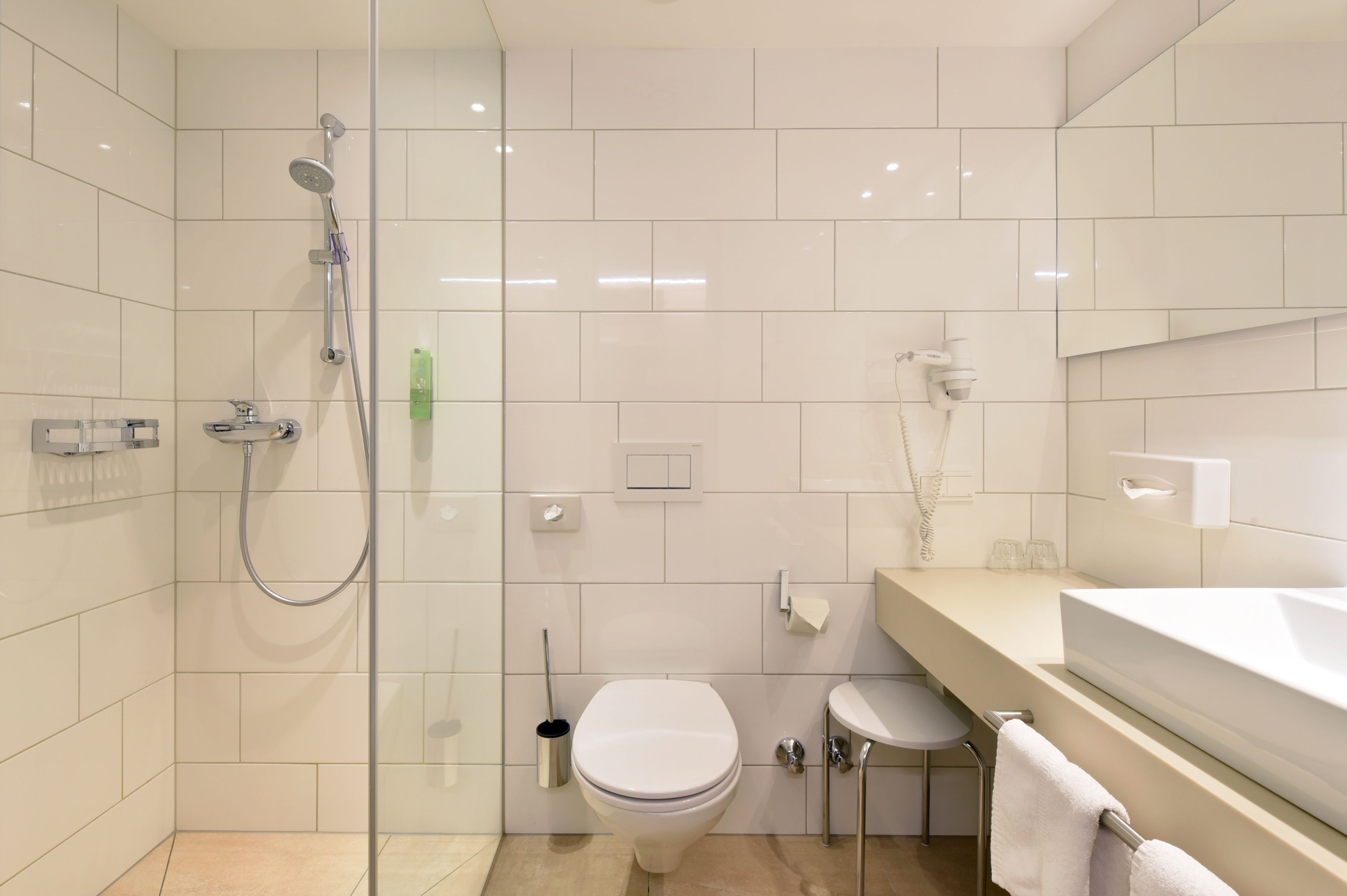 superior single room | bathroom | shower, free toiletries, hair dryer, towels