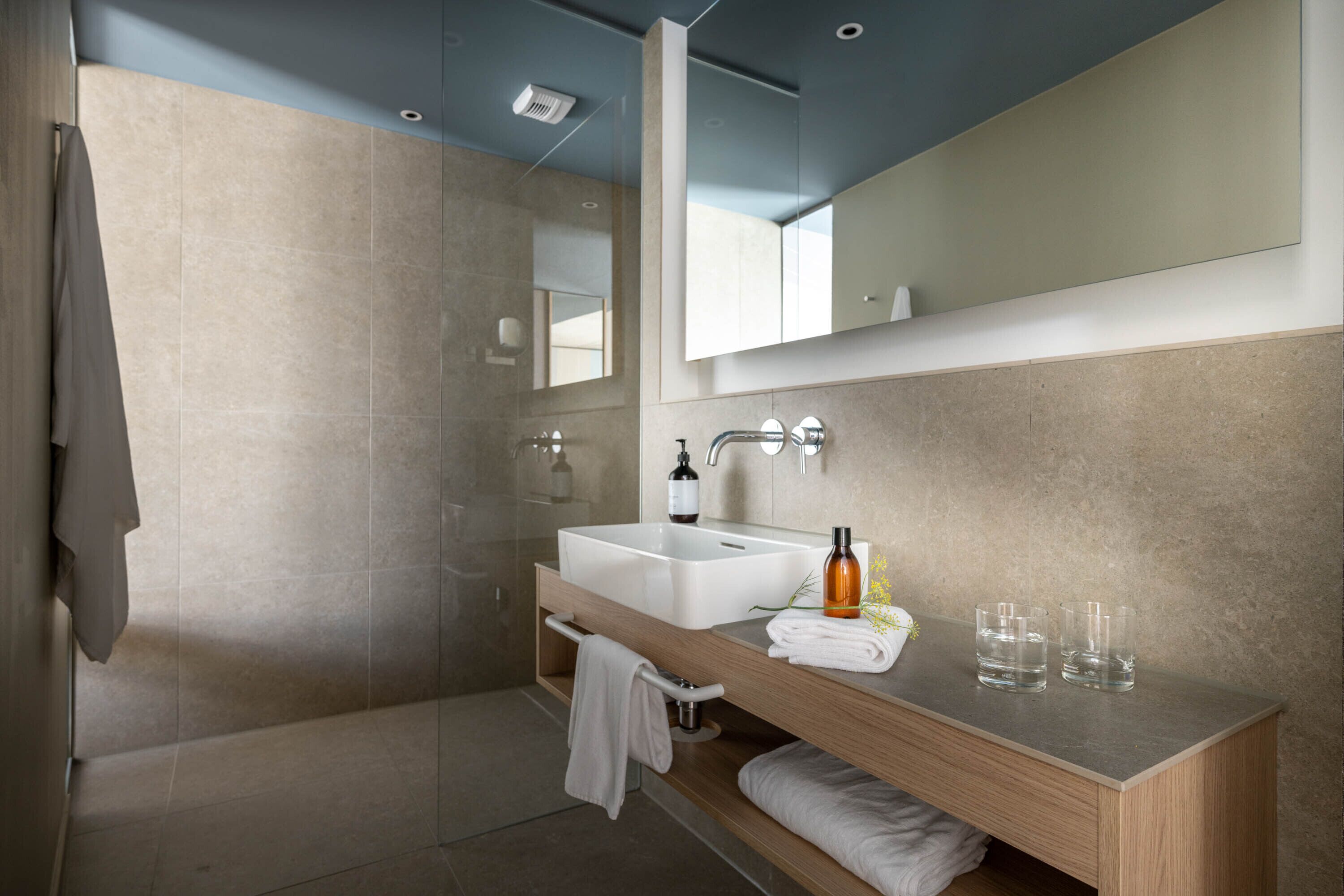 hair dryer, bathrobes, slippers, towels