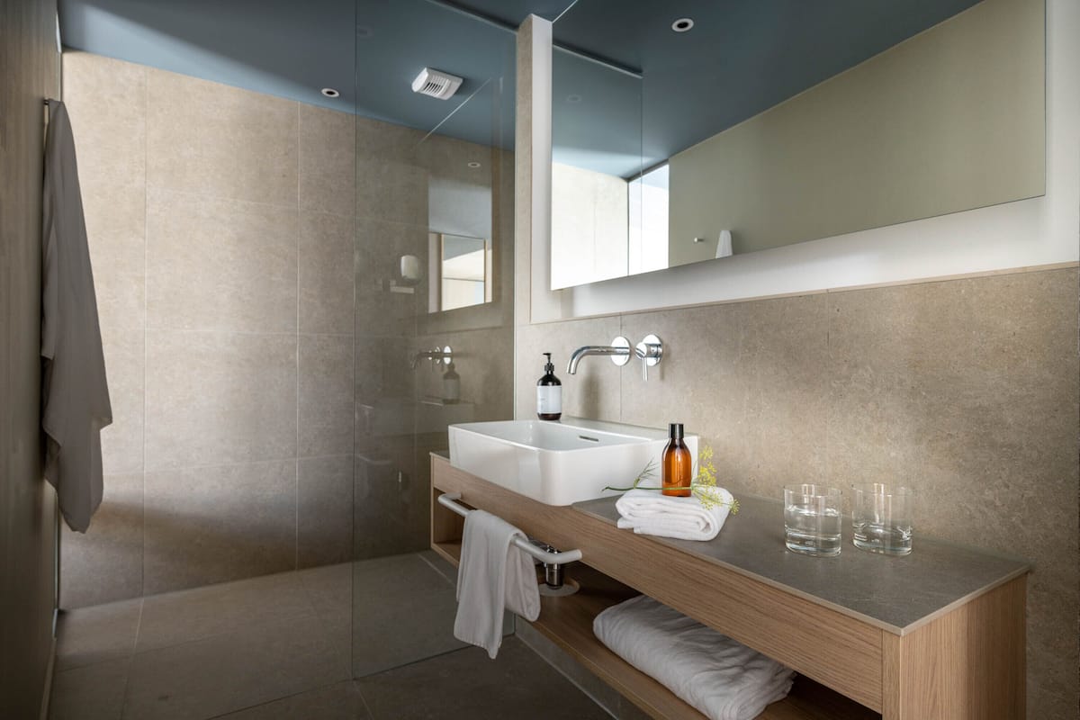 hair dryer, bathrobes, slippers, towels