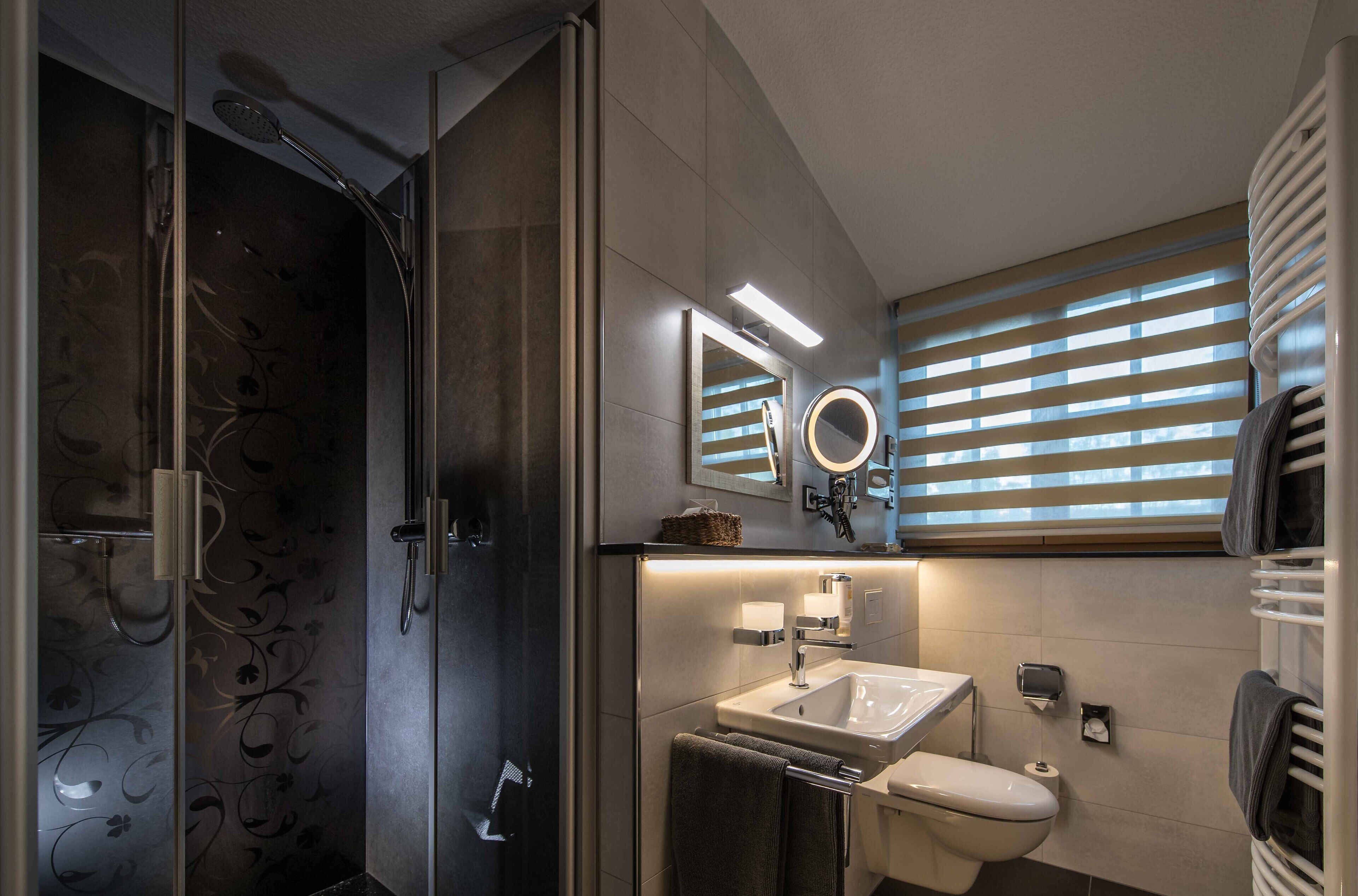 family room | bathroom | shower, free toiletries, hair dryer, bathrobes