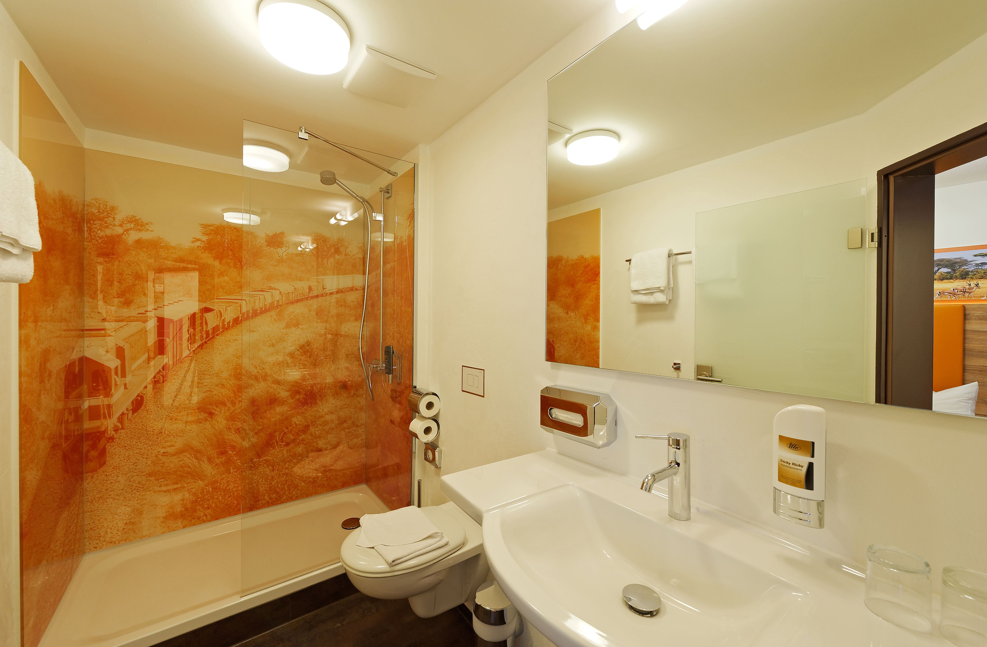 comfort quad room for 2 adults and 2 children | bathroom | hair dryer, towels