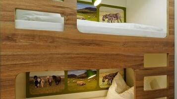 A bunk bed with a wooden exterior and multiple compartments.