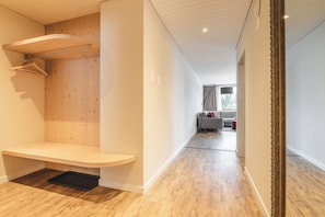 Deluxe Apartment, Balcony, Mountain View | Living area | 40-inch TV with satellite channels, books