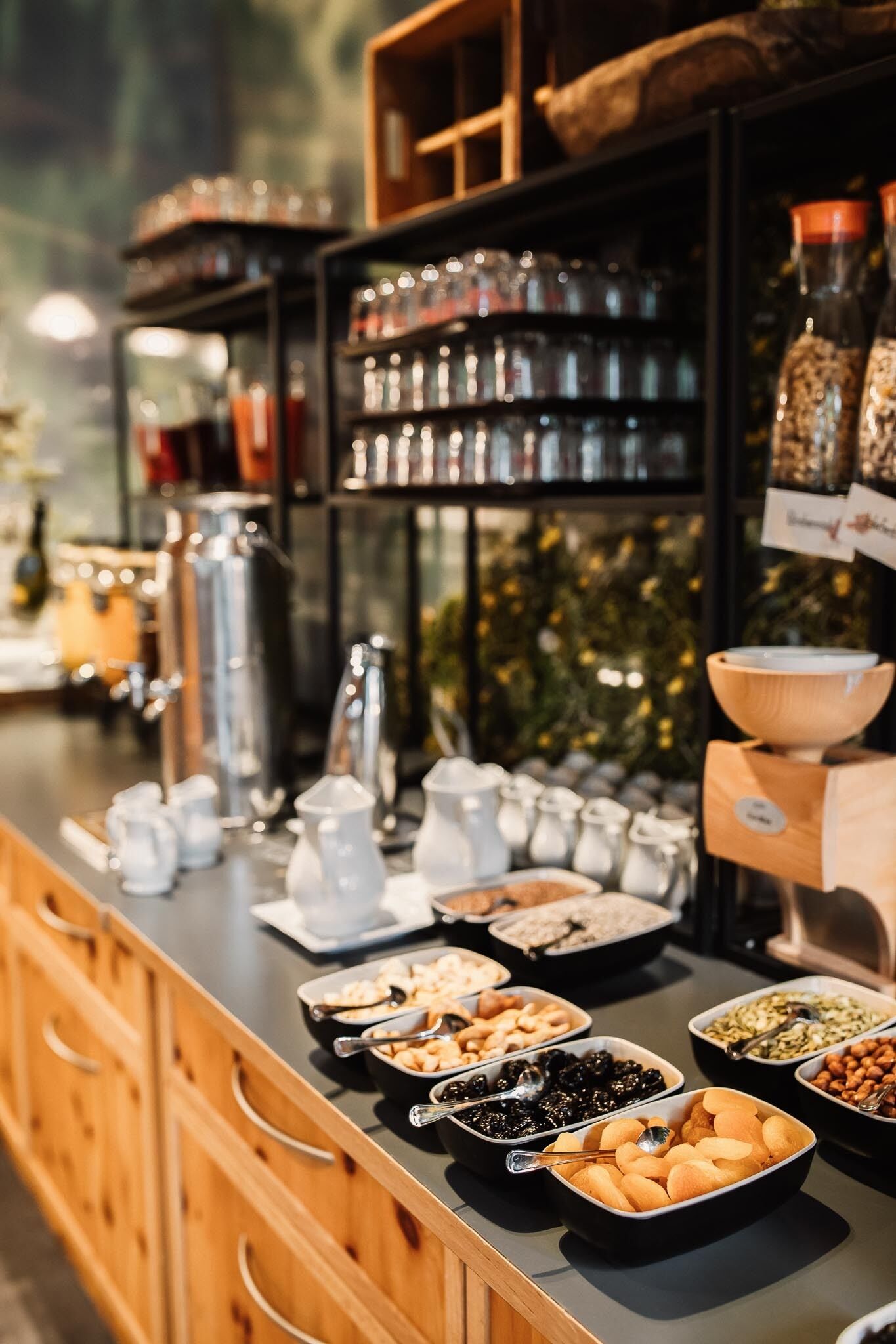 A buffet with various food items and condiments.