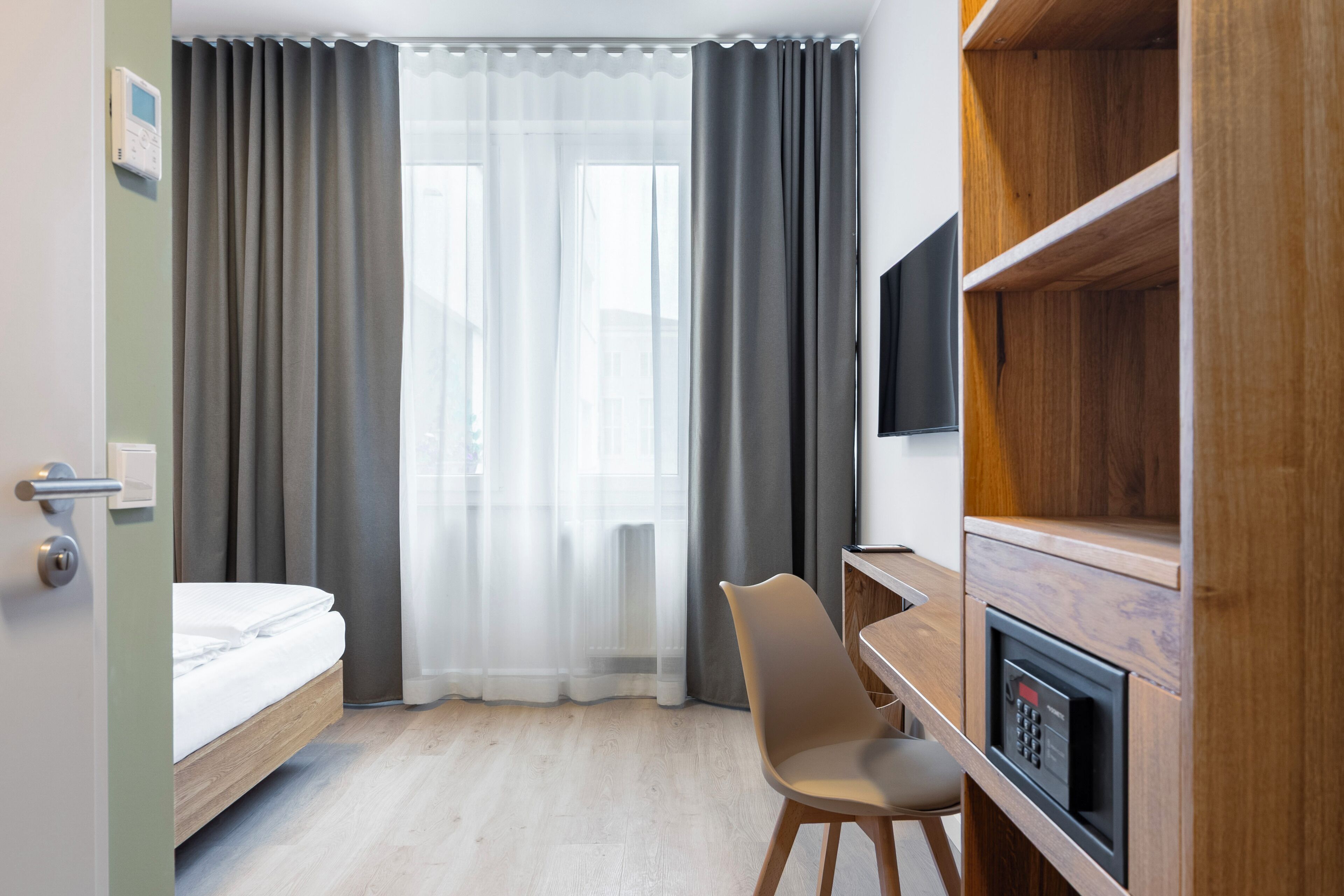 Comfort Double Room, City View | In-room safe, desk, laptop workspace, iron/ironing board