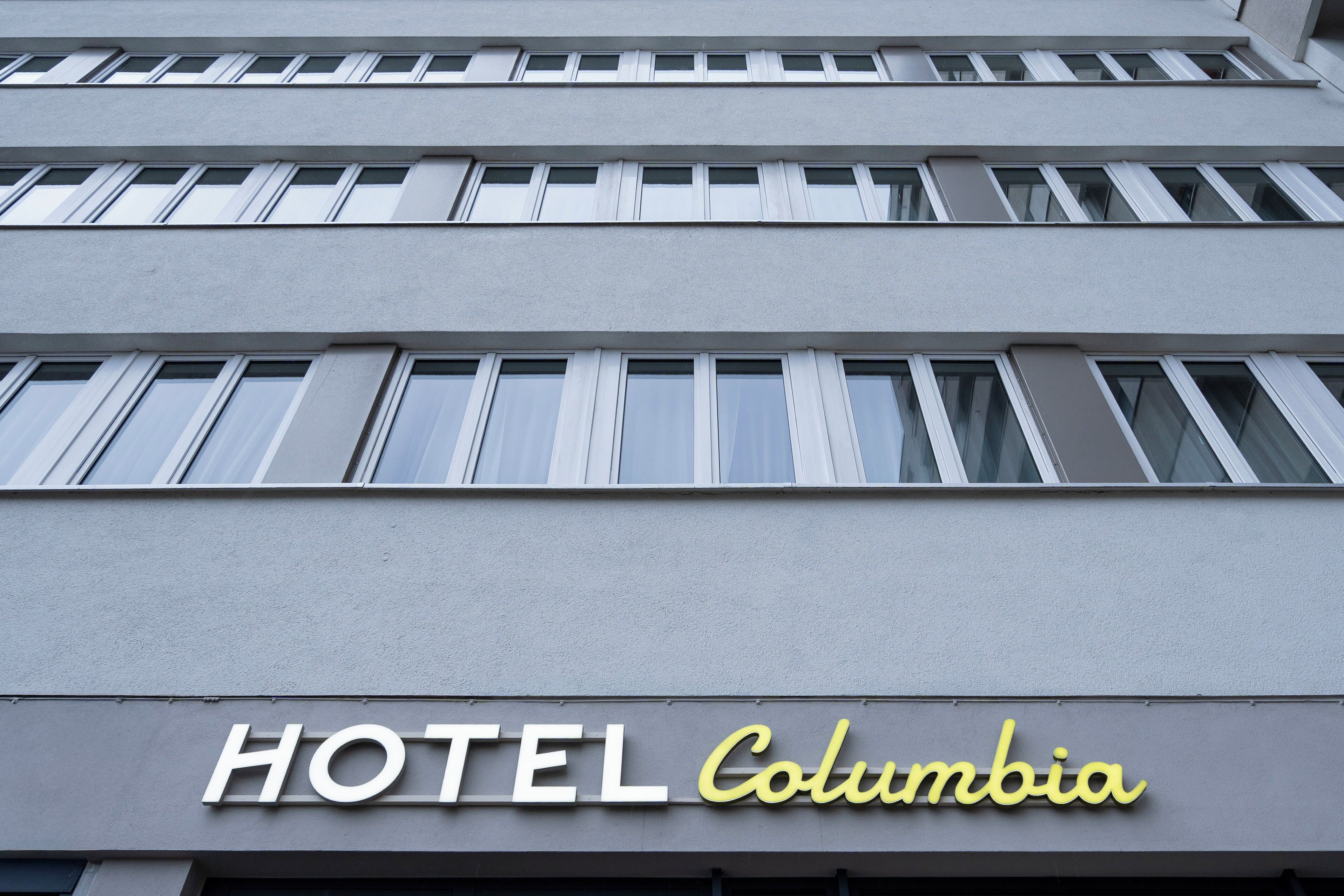 A building with a sign that reads "HOTEL Columbia."