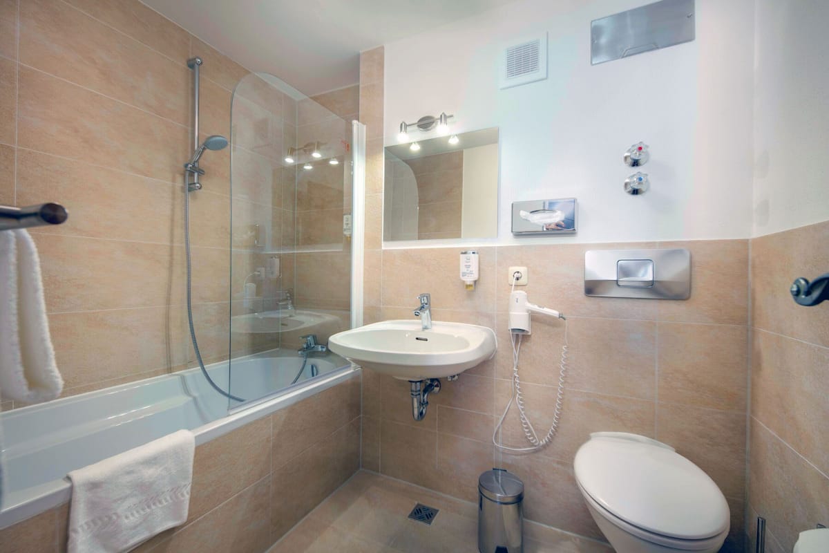 suite | bathroom | shower, hair dryer, towels