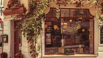A storefront with a large window displaying various items.