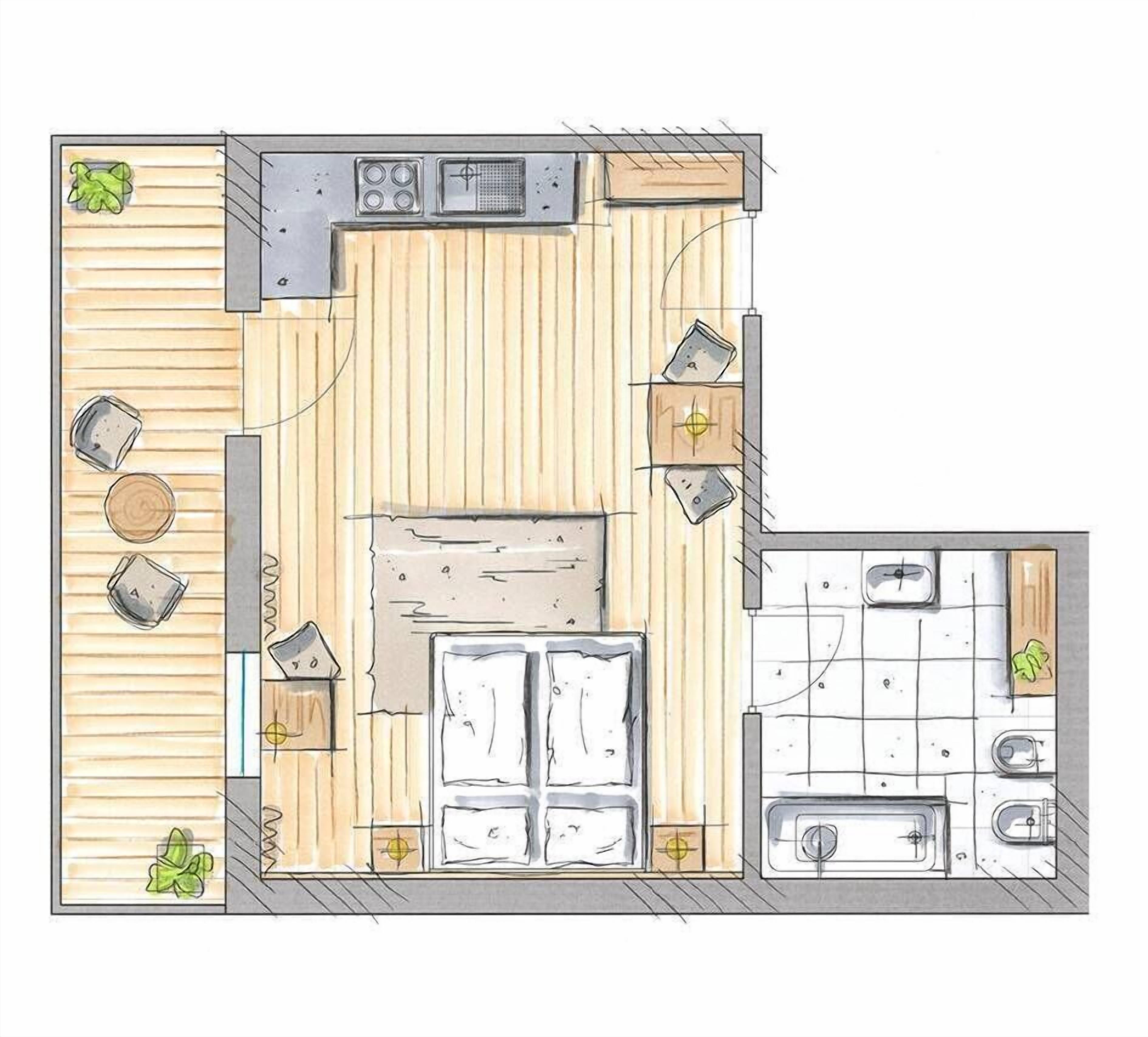Una cocina con una isla central, un comedor con mesa y sillas, y una pequeña zona de estar con un sofá y una planta.