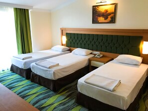 Triple Room, 3 Twin Beds | Minibar, in-room safe, free WiFi, bed sheets
