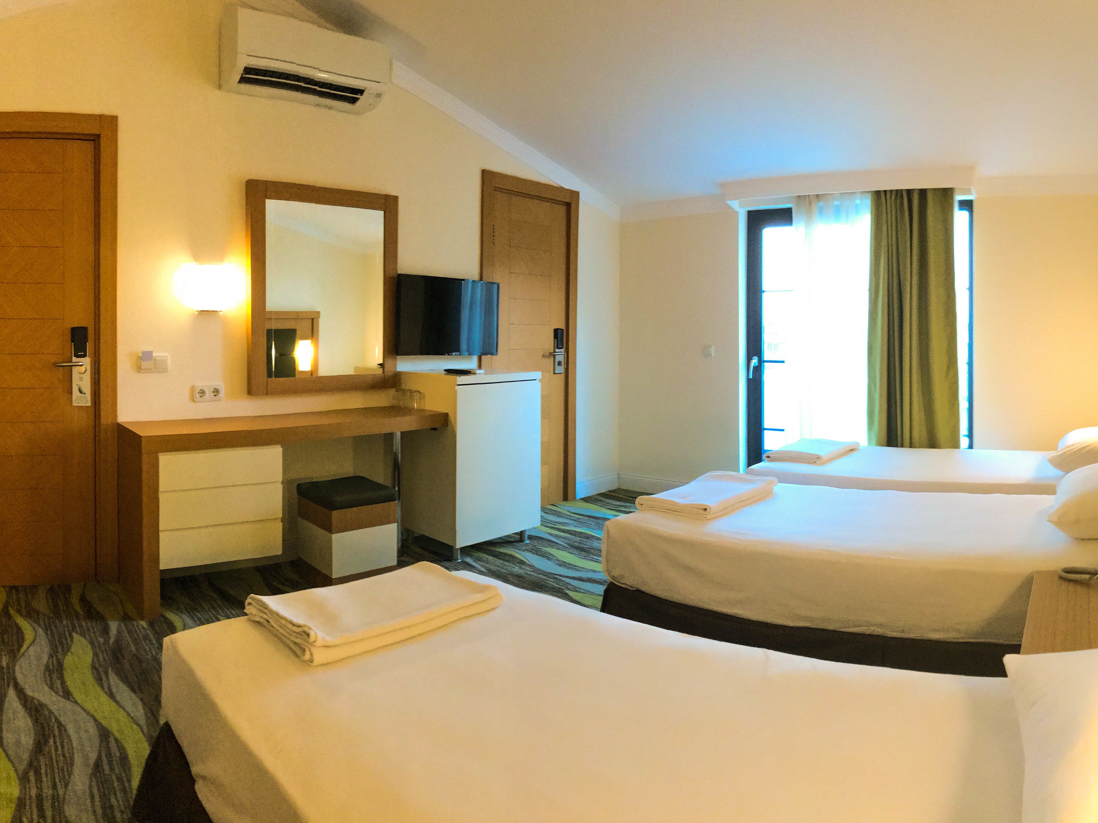 triple room, 3 single beds | minibar, in-room safe, free wifi, bed sheets
