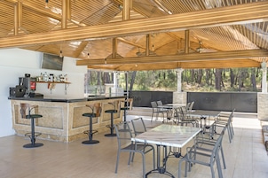 2 bars/lounges, 2 swim-up bars, poolside bar, beach bar