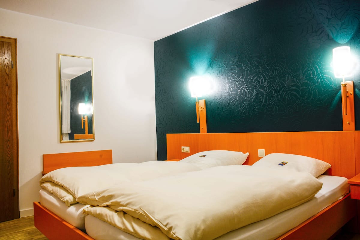 standard double room | premium bedding, down duvets, in-room safe, desk