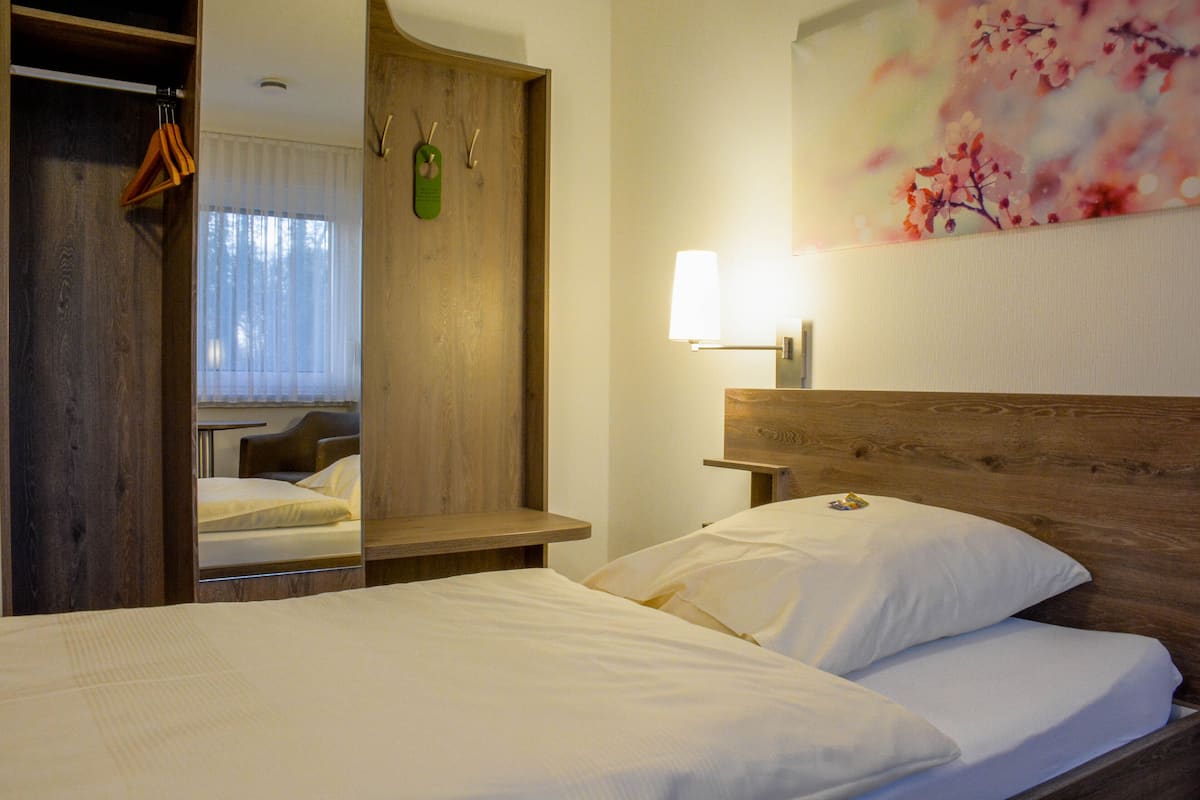 comfort single room | premium bedding, down duvets, in-room safe, desk