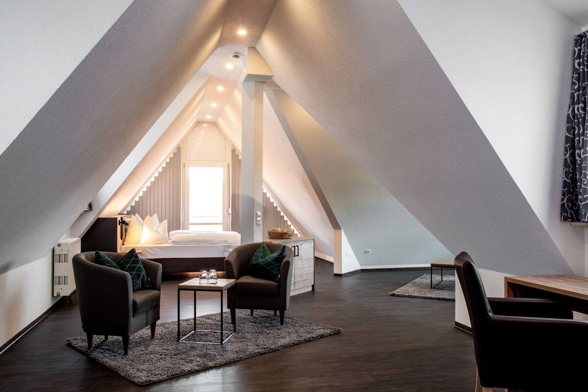 junior suite deluxe | living area | flat-screen tv