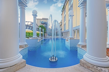 Indoor pool, outdoor pool, open 8 AM to 7:00 PM, pool umbrellas