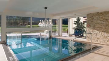 Indoor pool, pool umbrellas, pool loungers